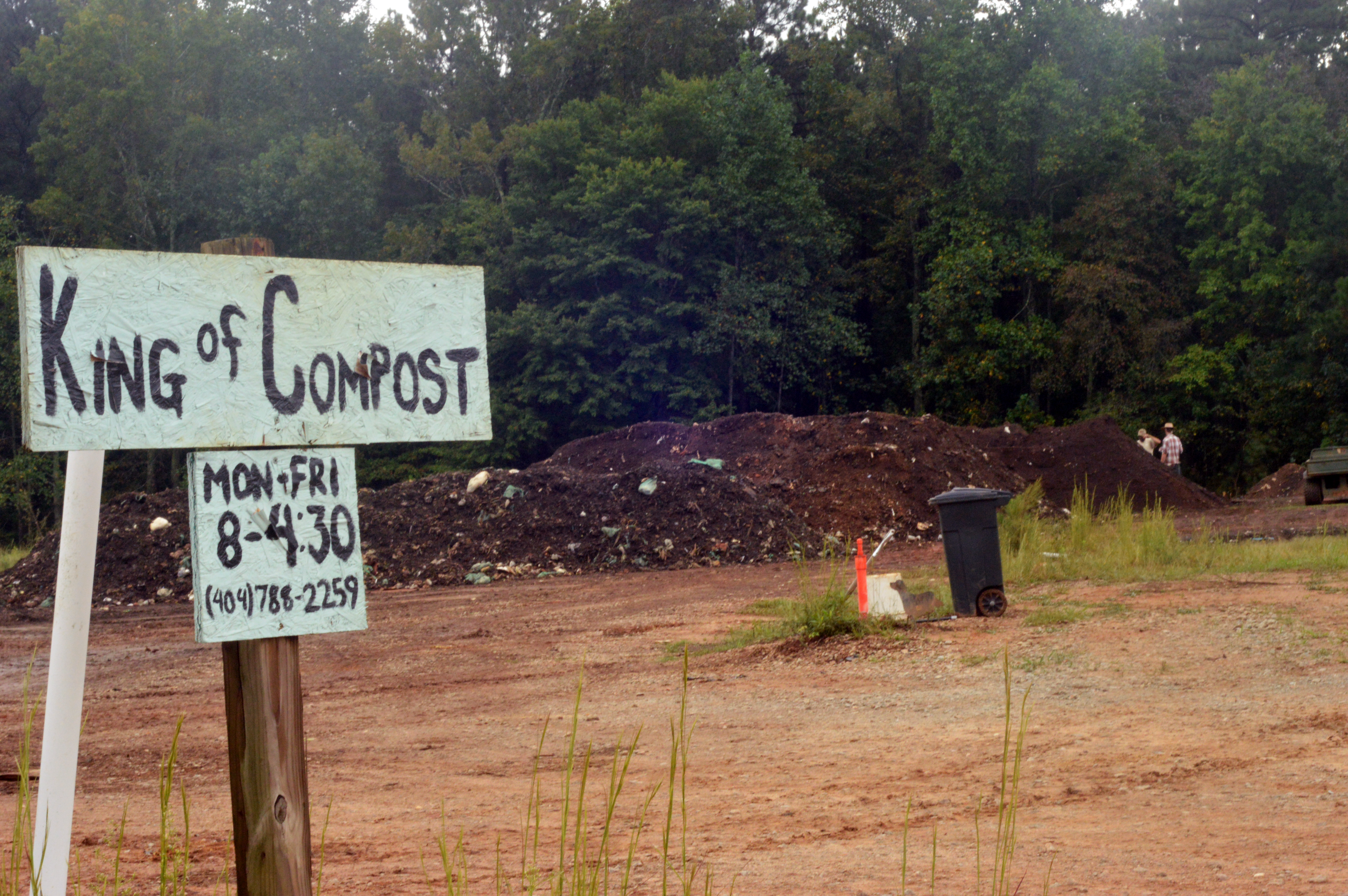 King of Compost sign next to a compost pile