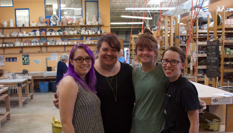 MudFire studio resident artists, Kaitlyn Chipps, Meredith Bradley, Marisa Mahathey, and owner Daphne Ranlett (middle).