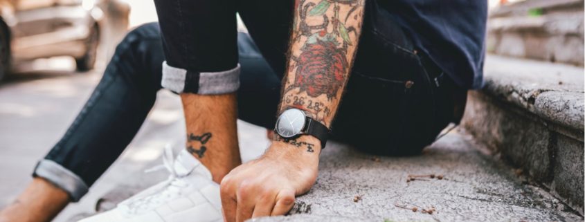 Young man with colorful tattoo sleeve.