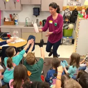 Paula Garcia Todd showing a cloud in a bottle to a group of students.