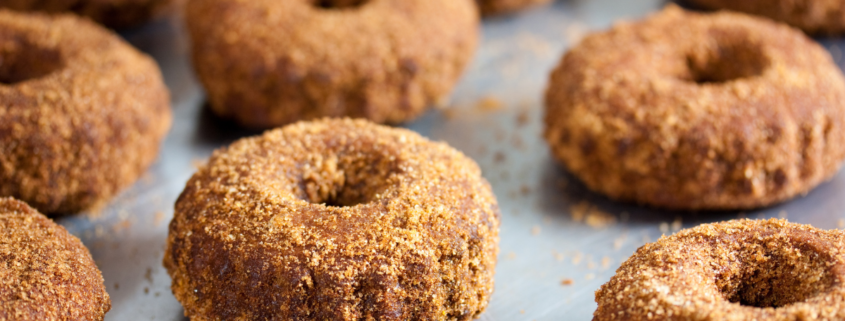 Tray of freshly made vegan apple cider doughnuts