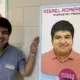 Misael Romero-Reyes standing in front of a poster about himself as a scientist.