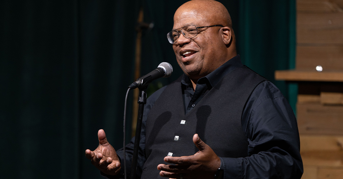 A man speaking at Science ATL’s Story Collider