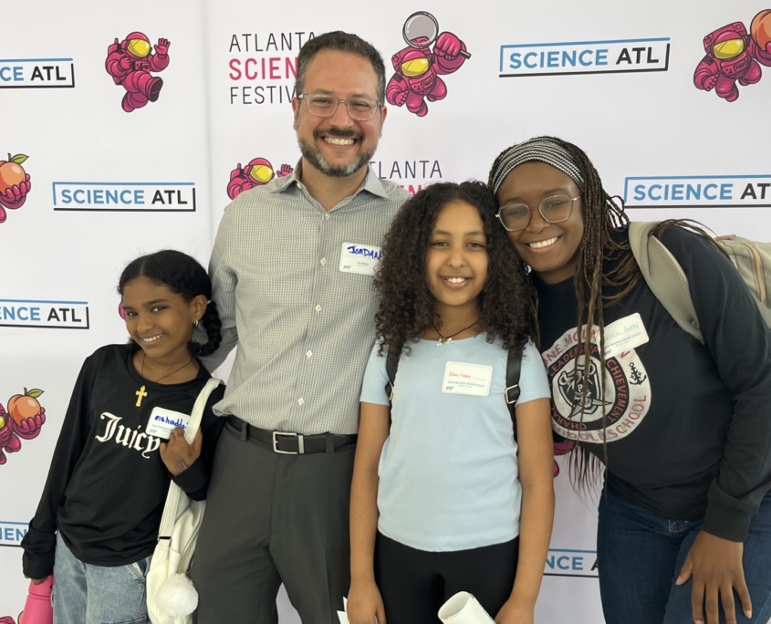 Co-executive director Jordan Rose is all smiles with the team from Stone Mountain Middle School